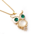 Golden owl pendant necklace with green gemstone eyes and white cubic zirconia details - Green-Eyed Owl