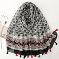 Bohemian floral print scarf with tassel trim on white background with magazine - Black White & Red Floral Geometric Patchwork (SL2506-013)