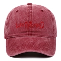 Close-up of gothic Lost My Head embroidery on washed burgundy cotton baseball cap - Burgundy