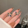 Elegant s925 gold bow earrings with black enamel and sparkling crystals on fingertips - Gold Black Bow
