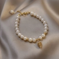 Baroque freshwater pearl bracelet with gold pine cone charm on silk background - 31# Summer Fruit Pearl Bracelet