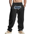Dettaglio della stampa MA YON Motorcycle su pantaloni streetwear neri larghi da uomo - Taglia S / Pantaloni e gonne / Nero
