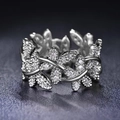 Elegant silver vine leaf ring with shimmering zircon crystals on textured black leather - US 7 / White Gold