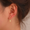 Minimalist golden teardrop earrings set with polished finish shown on a model - Gold (M-078)