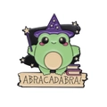 Wizard frog enamel pin with purple hat, cloak and books featuring Abracadabra banner - Green Wizard Frog