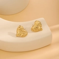 Golden heart stud earrings with irregular lava texture displayed on an elegant stand - E6204-25-Lava Heart B