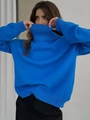 Detail of blue high neck sweater showing knitted texture and ribbed cuff design - S / Blue