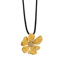 Detailed view of 18k gold flower pendant with zircons and black cord necklace - Gold