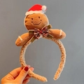Christmas headband featuring a plush gingerbread man with a red hat and plaid bow - Cute Gingerbread Man Headband