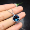 Elegant halo pendant necklace with deep blue round gemstone and silver chain - Tz-24