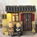 Elderly couple figurines with cat and magnifying glass on rustic home background - Old Couple Figurine / 935-11 House Holding Cat