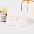 White greeting card with golden Best Wishes For You text and a heart pattern - Best Wishes For You