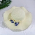 Close-up of woven straw sun hat brim with elegant blue gingham bow decoration - M (56-58cm) with Wind Rope / Creamy White