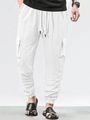 Detail of white cargo pants featuring textured check pattern and drawstring elastic waist - S / Bottoms / White