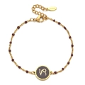 Detail of gold stainless steel beaded bracelet with red agate and Capricorn zodiac charm - Stainless Steel / Capricorn-Dark Red