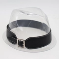 Close-up of a clear plastic hat stand featured with a black faux leather buckled strap belt - One Size / Black Wide Leather