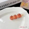 Creative 6cm realistic meatball skewer hair clip accessory on white ceramic plate - Sauce Braised Meatballs