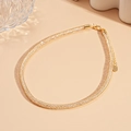 Detailed shot of golden mesh chain necklace with lobster clasp and extension link - Round Style / Gold / Necklace