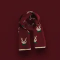 Detail of red Christmas knit scarf with white reindeer horn patterns and green accents - Christmas Antler Pattern Knit / Burgundy