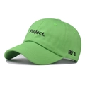 Close-up of green cotton baseball cap with Project embroidery and 90's side detail - Adjustable / Green