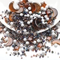 DIY jewelry beads set featuring amber moon and star charms with white pearl seed beads - Black Coffee