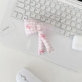 Detail view of a pink quilted bow pouch resting on a white laptop for daily storage - Pink Gingham Bowknot Accessory