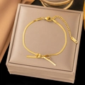 Elegant gold bow pendant necklace with snake chain and adjustable clasp on jewelry box - [B99] Bow Anklet-Gold