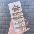 Detailed close-up of a 5-piece gold hair clip set with pearls and sparkling rhinestones - Qingqing Style (5 Piece Set)