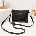 Black crocodile pattern crossbody bag with shiny patent leather and golden zipper detail - Black