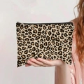 Detailed close-up of the leopard print canvas makeup bag with a sturdy metal zipper closure - Dense Brown Black Leopard Style (jiayingpbb0151)
