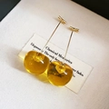 Macro shot of amber cherry-shaped resin earrings with gold hooks in a gift display box - 12# Steel Needle - Gold Amber Cherry (HE21137)