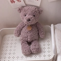 Plush teddy bear toy in soft lavender fleece with brown leather tag for room decor - Coffee Bear