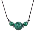 Macro detail of green malachite round beads with black woven rope and metal spacers - Malachite - Necklace