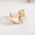 Gold layered cuff bracelet with pink oval gemstone and hammered texture on white background - R01039-Gold Pink Oval Stone