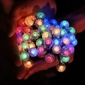 Multicolor LED bubble ball fairy lights held in hands creating a dreamy festive atmosphere - 1.5m 10LED Battery / Crystal Lamp