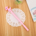 Pink neutral pen with cute soft rubber giraffe topper on a wooden desk with lace decor - Pink Deer