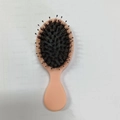 Mini pink scalp massage air cushion hairbrush with black bristles for portable hair care - Elastic Paint Orange Bristle