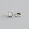 Close-up of S925 sterling silver hoop earrings with shimmering cubic zirconia inlay - Outer Diameter 10mm / Silver