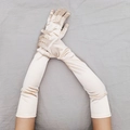 Detailed view of long champagne satin gloves with elastic fit for 1920s vintage party costumes - One Size / Champagne