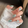 Close-up of elegant light green press-on nails with pearl and silver flower details - By1536 Shuxiang Bihua / Glue Type