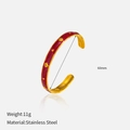 Detail of gold-plated stainless steel star bangle with red enamel and 60mm diameter - Red