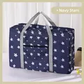 Foldable large capacity travel duffel bag in navy blue with white star pattern and handles - Navy Stars