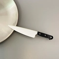Creative chef knife hair clip with silver blade and black handle on gray background - Simulation Kitchen Knife / Silver Black
