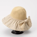 Cappello da sole beige a tesa larga da donna con grande fiocco e protezione UV - M (56-58cm) / Bianco Sporco