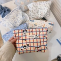 Close-up of blue cartoon dog cotton makeup bag with zip and simple wish label - Red Blue Grid Puppy