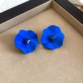 Macro shot of blue flower stud earrings with a sapphire square crystal in a jewelry box - Silver Earring Post-Blue