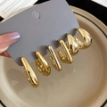 Detailed view of three pairs of chunky gold C-shaped hoop earrings on a display card - Gold with Silver Pin (Set of 6)