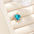 Exquisite gold-plated heart pendant with center blue gemstone and pavé diamonds - Lake Blue Pendant