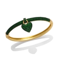 Elegant gold bangle with heart charm featuring pave emerald green cubic zirconia - Green