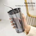 Smoky grey translucent glass cup with black lid and stainless steel straw in hand - Smoky Grey + Black Lid + Stainless Steel Straw